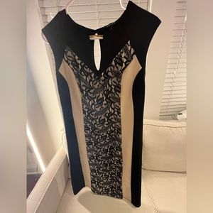 Black and tan dress with light embellishment and lace.